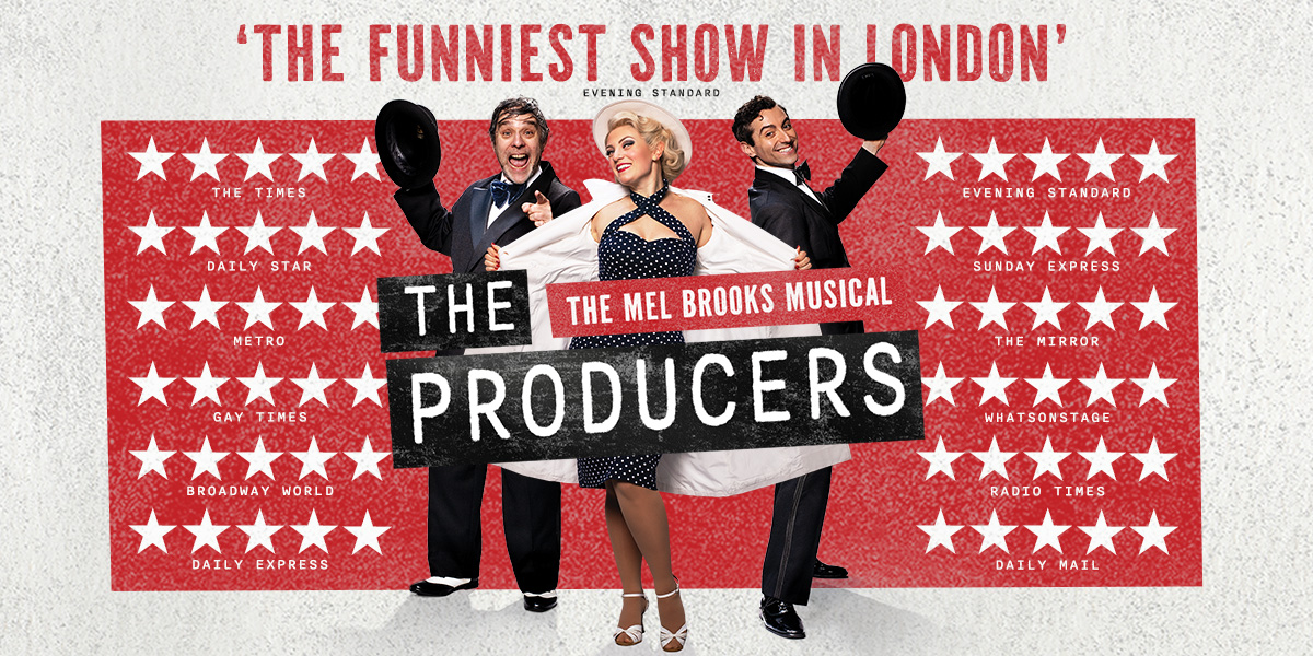 A group of four actors in theatrical costumes, performing on stage with dramatic lighting and a red curtain backdrop.