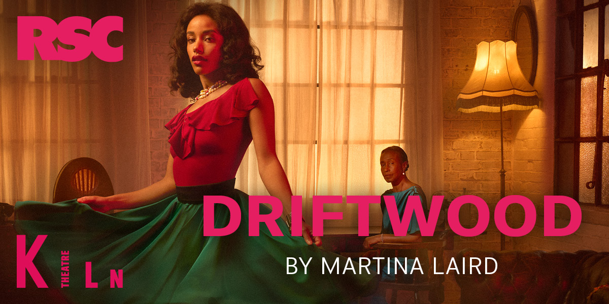 A piece of weathered driftwood rests on a sandy beach, surrounded by gentle waves and seashells.