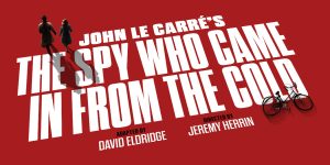 A close-up of ticket agent buttons featuring various symbols on a textured background, predominantly in dark colours.