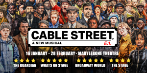 A view of Cable Street featuring brick buildings, street signage, and pedestrians walking along the pavement.