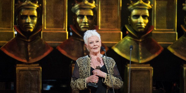 Judi Dench receiving an Olivier Award at the Olivier Awards.